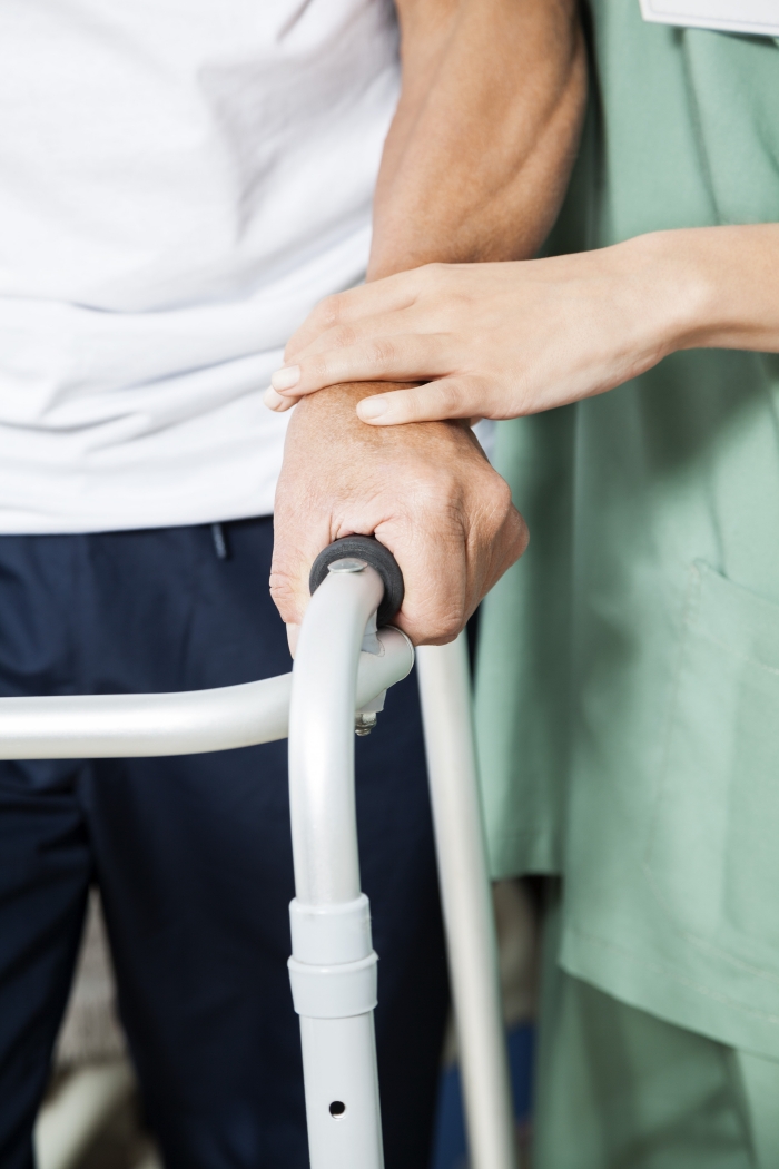 Kestrel care home nurse helping man with cane.jpg